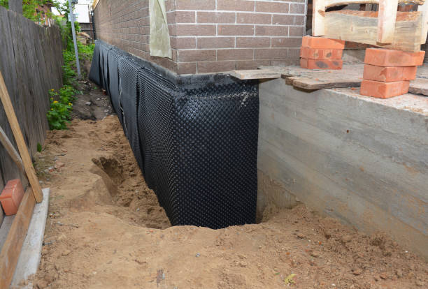 SJ Waterproofing Pros technician performing targeted Exterior Waterproofing assessment in Sturgis, KY